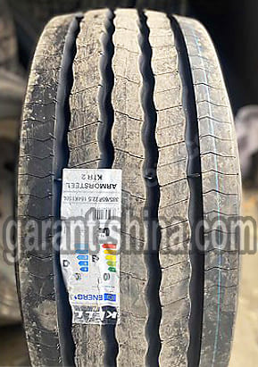 Kelly Armorsteel KTR2 (прицепная) 385/65 R22.5 164K(158L) 24PR HL - Фото протектора с этикеткой на улице